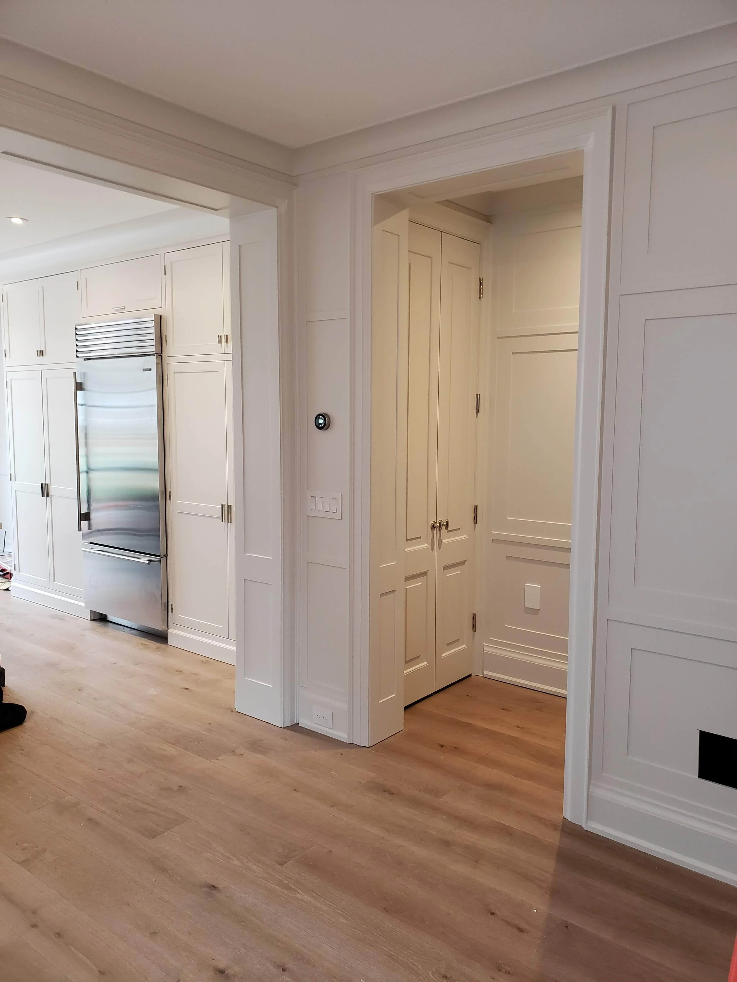 Custom spray paint finish on built-in shelving and trim — Belardi Brothers Toronto